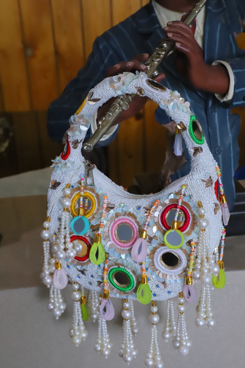 Multi beaded mirror clutch