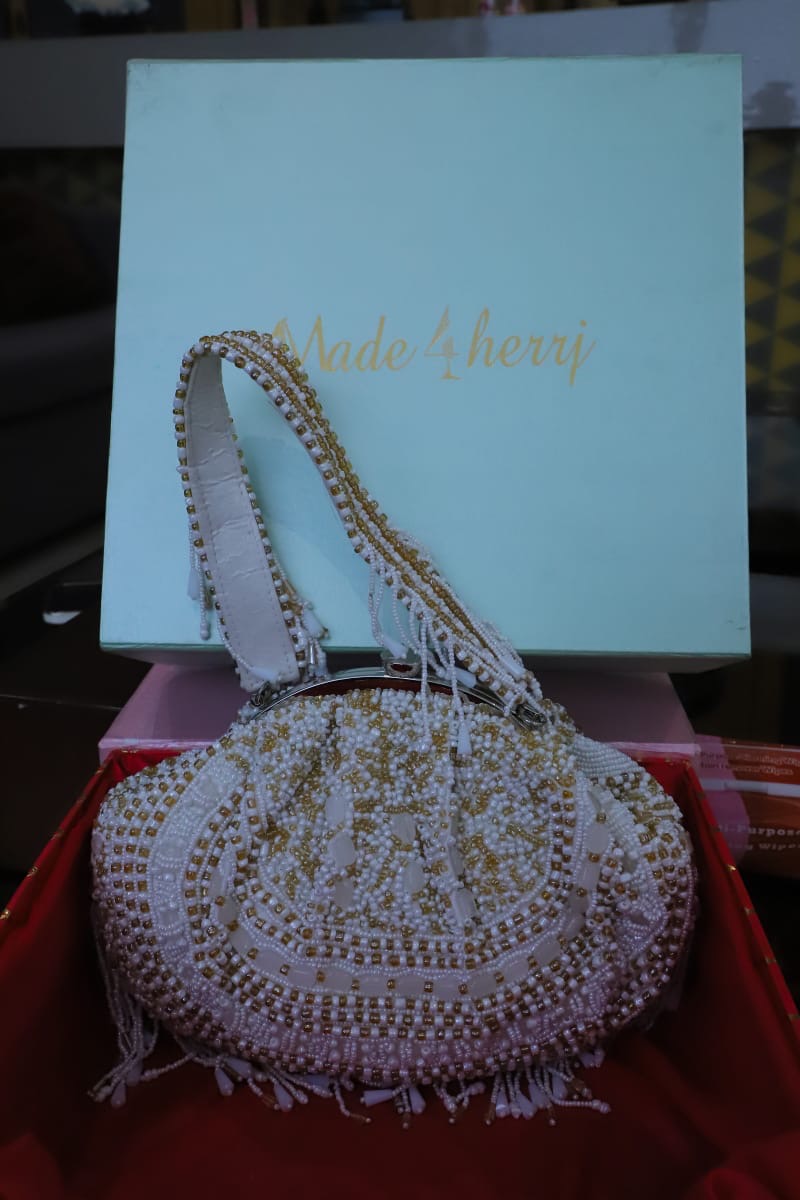White gold beaded clutch bag