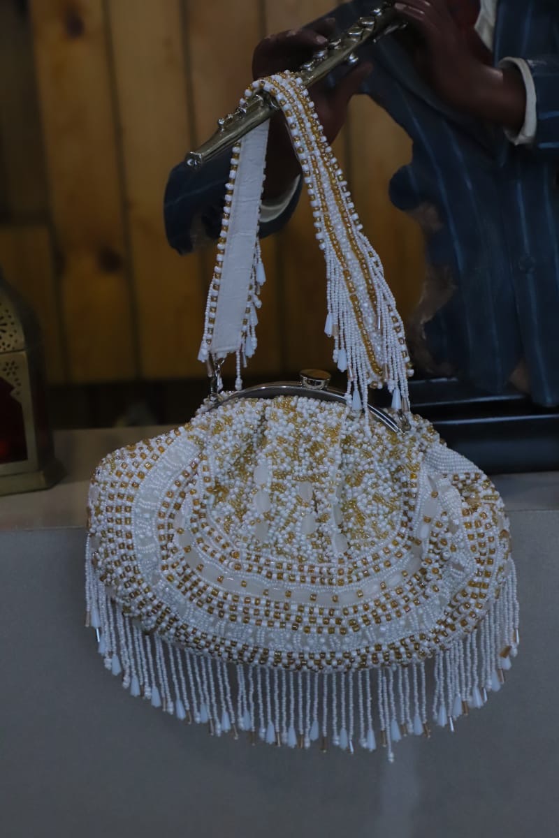 White gold beaded clutch bag