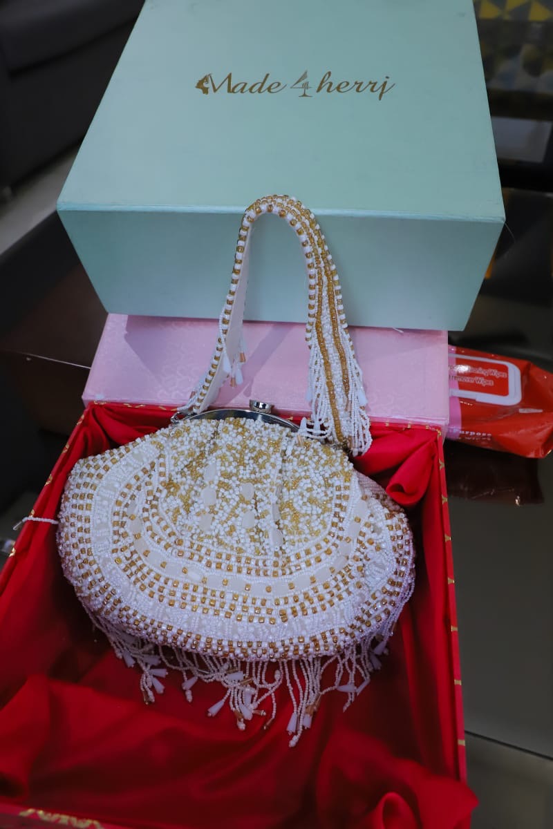 White gold beaded clutch bag