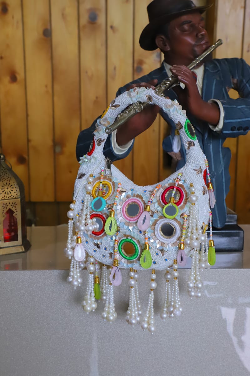 Multi beaded mirror clutch