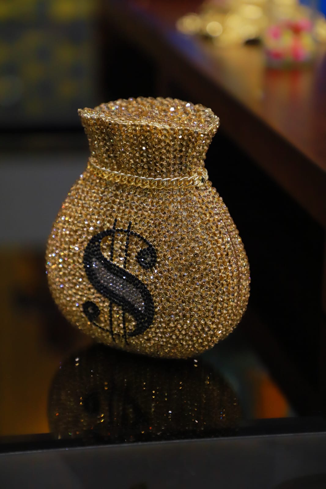 Dollar sign gold clutch bag