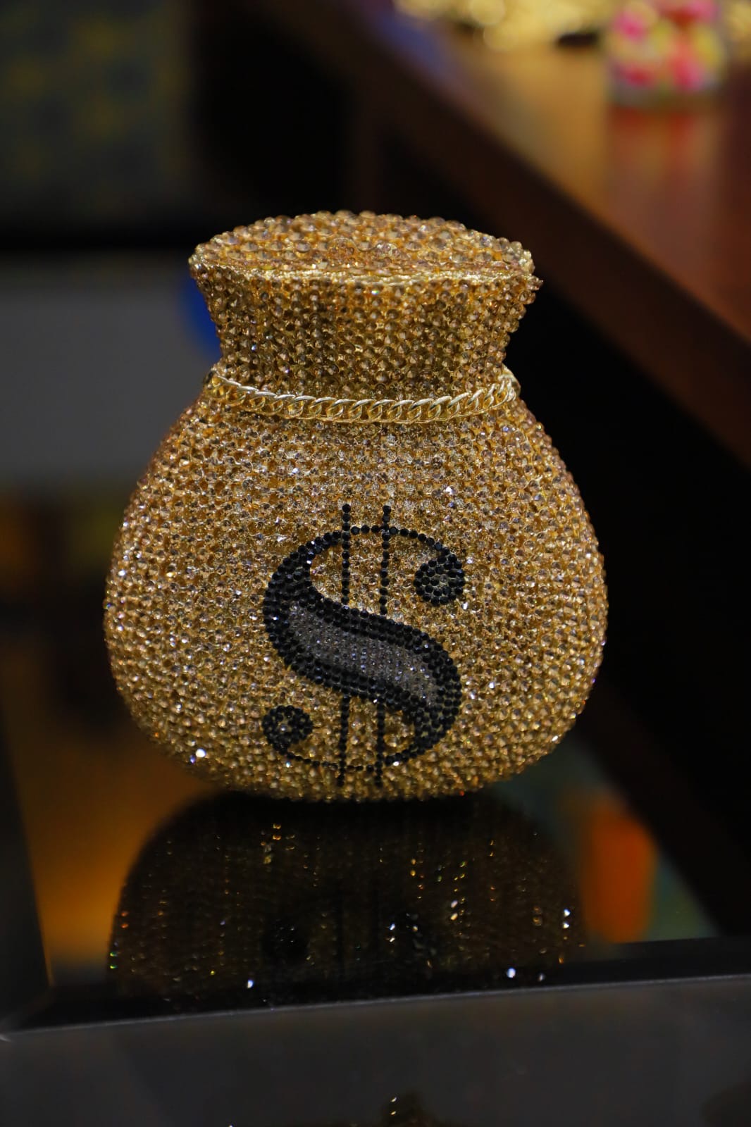 Dollar sign gold clutch bag