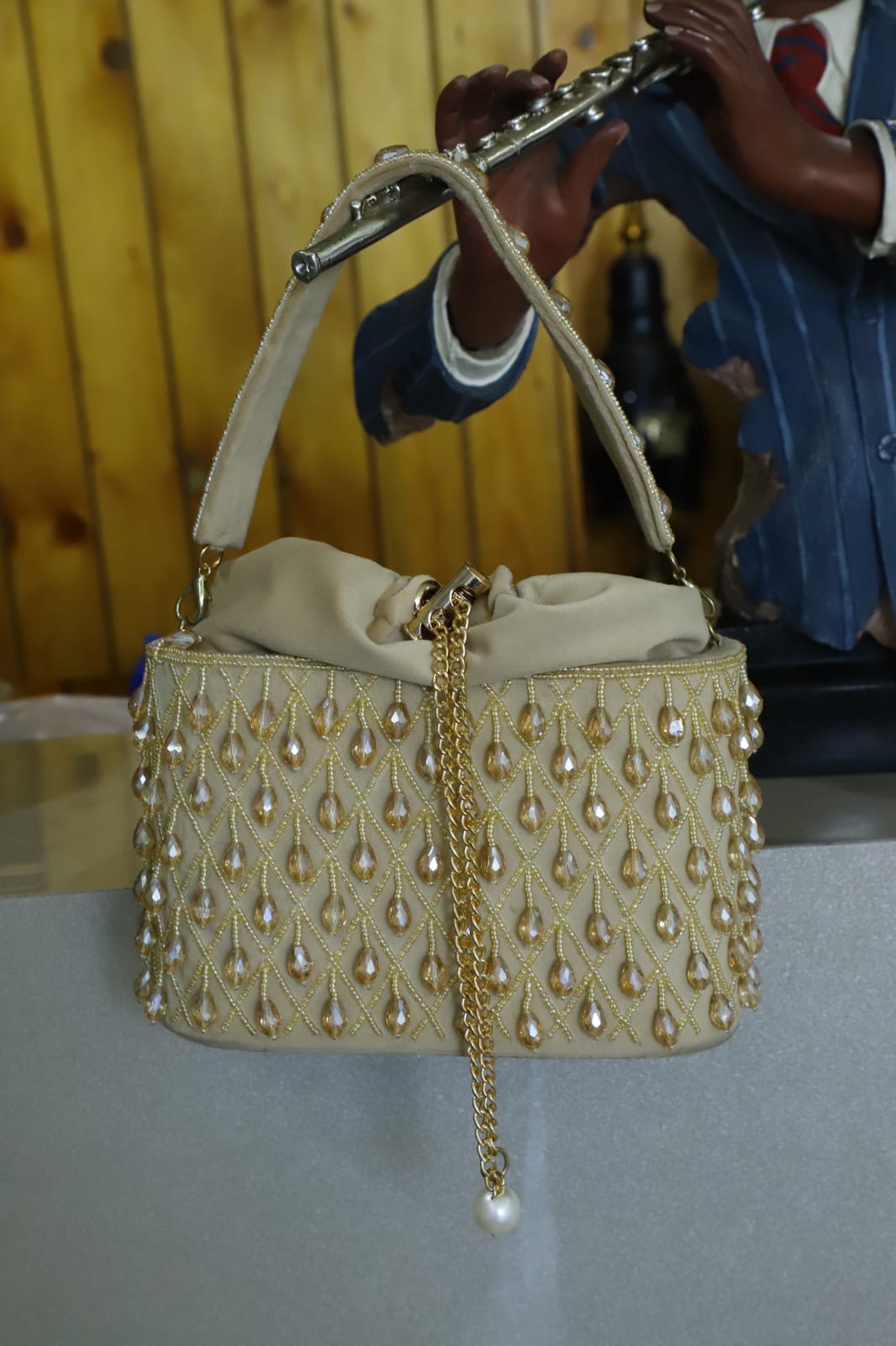 Beige crystal bucket bag