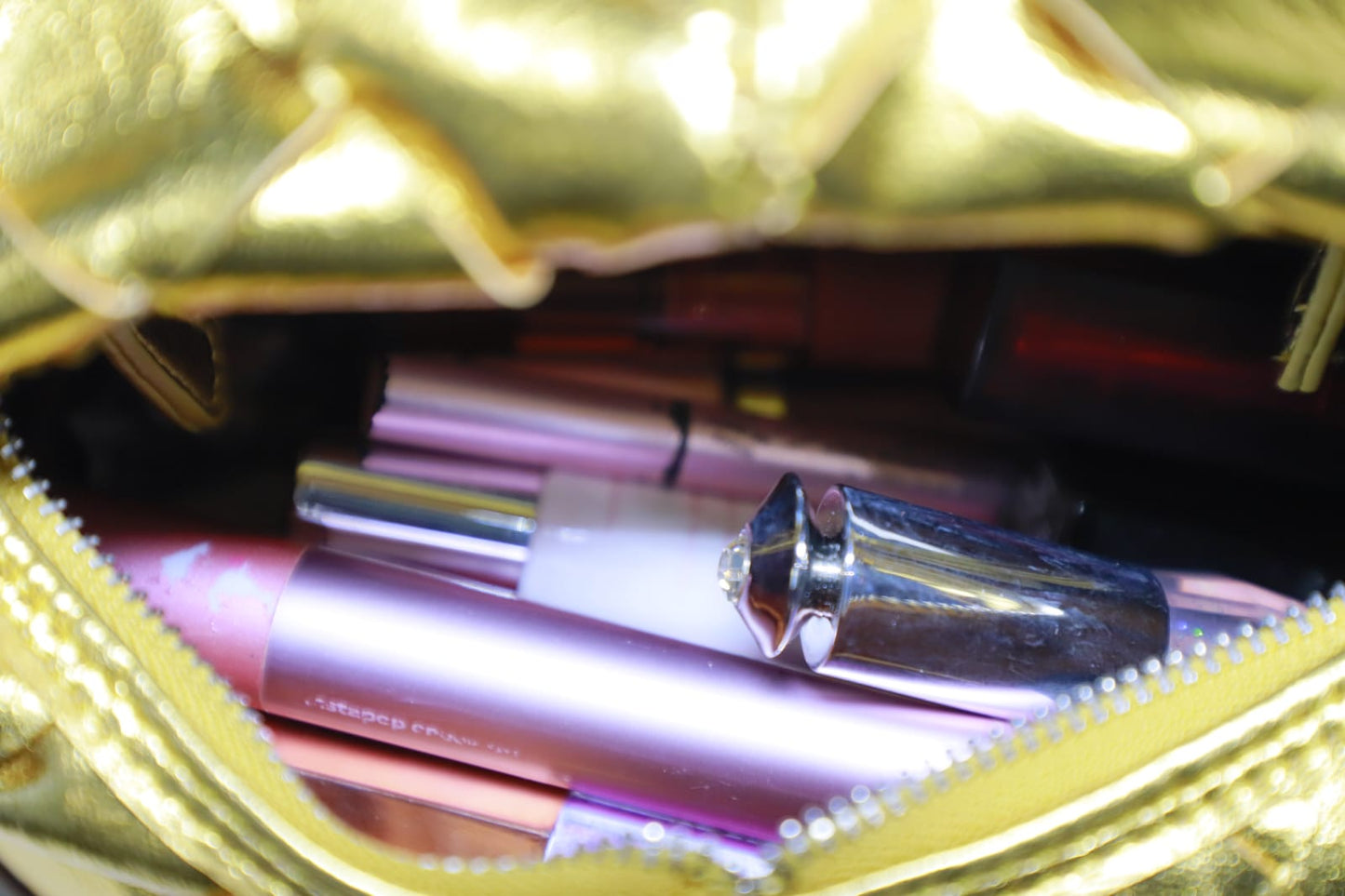 Golden rexin clutch bag
