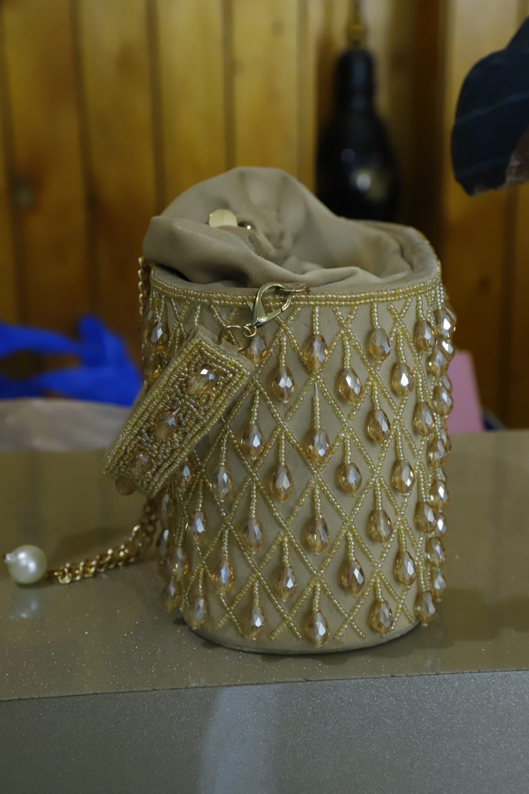 Beige crystal bucket bag