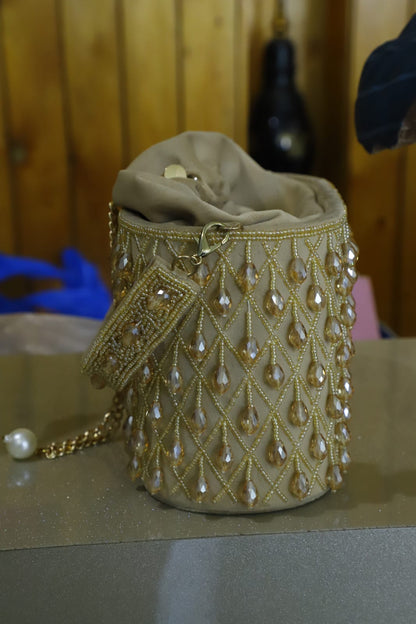 Beige crystal bucket bag