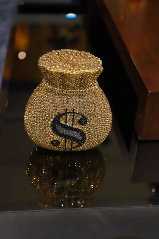 Dollar sign gold clutch bag