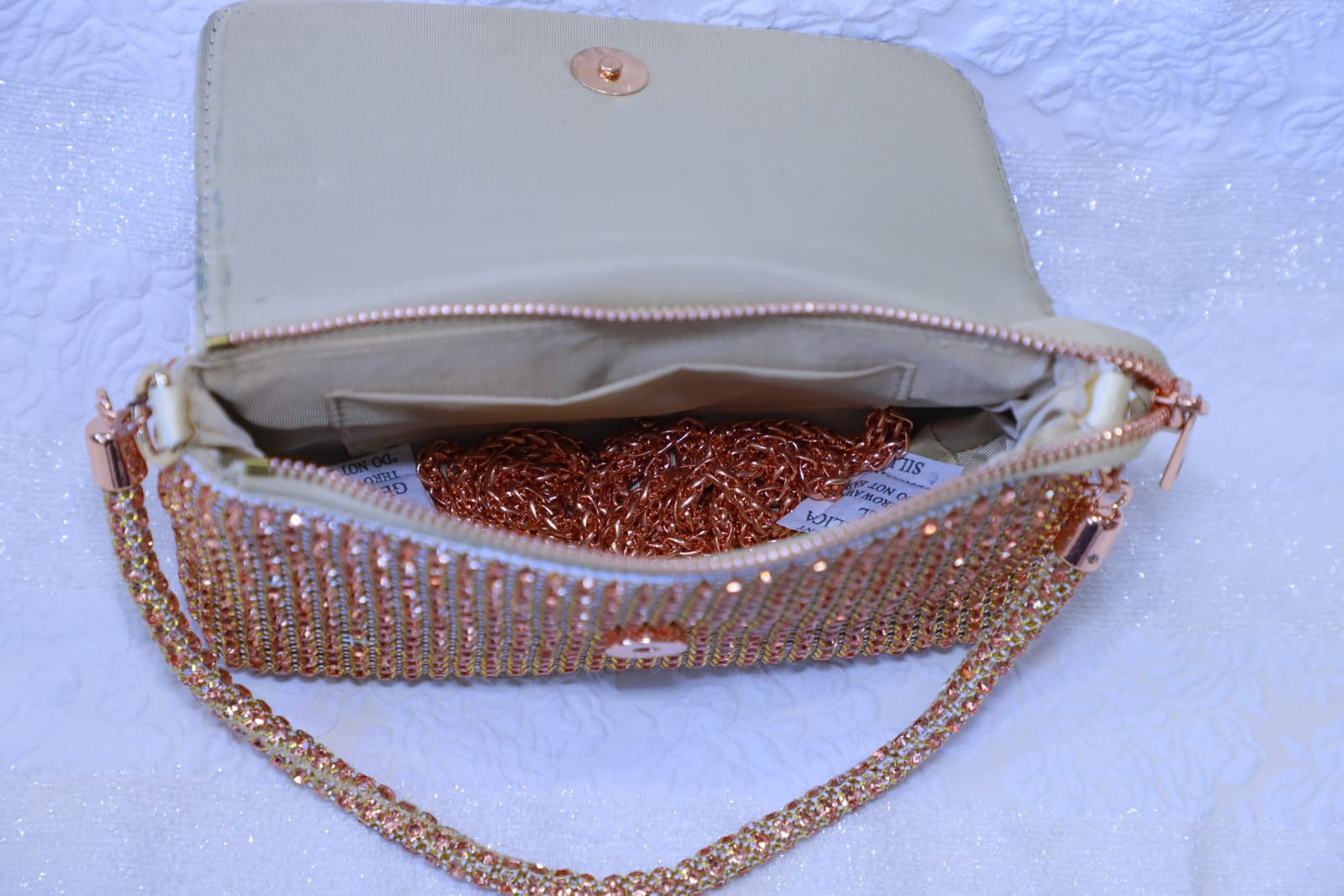 Rose gold Swaroski clutch bag