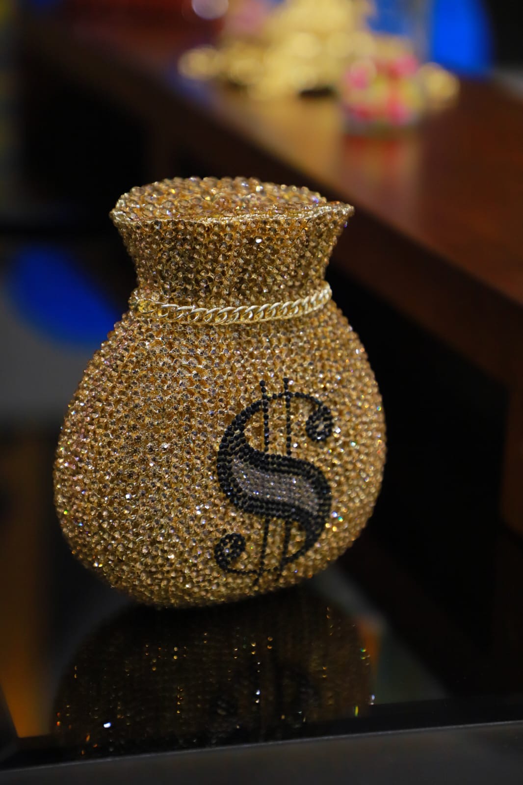 Dollar sign gold clutch bag